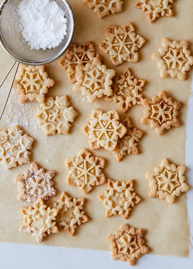 Gingerbread snowflake cookies before being dusted with sugar.