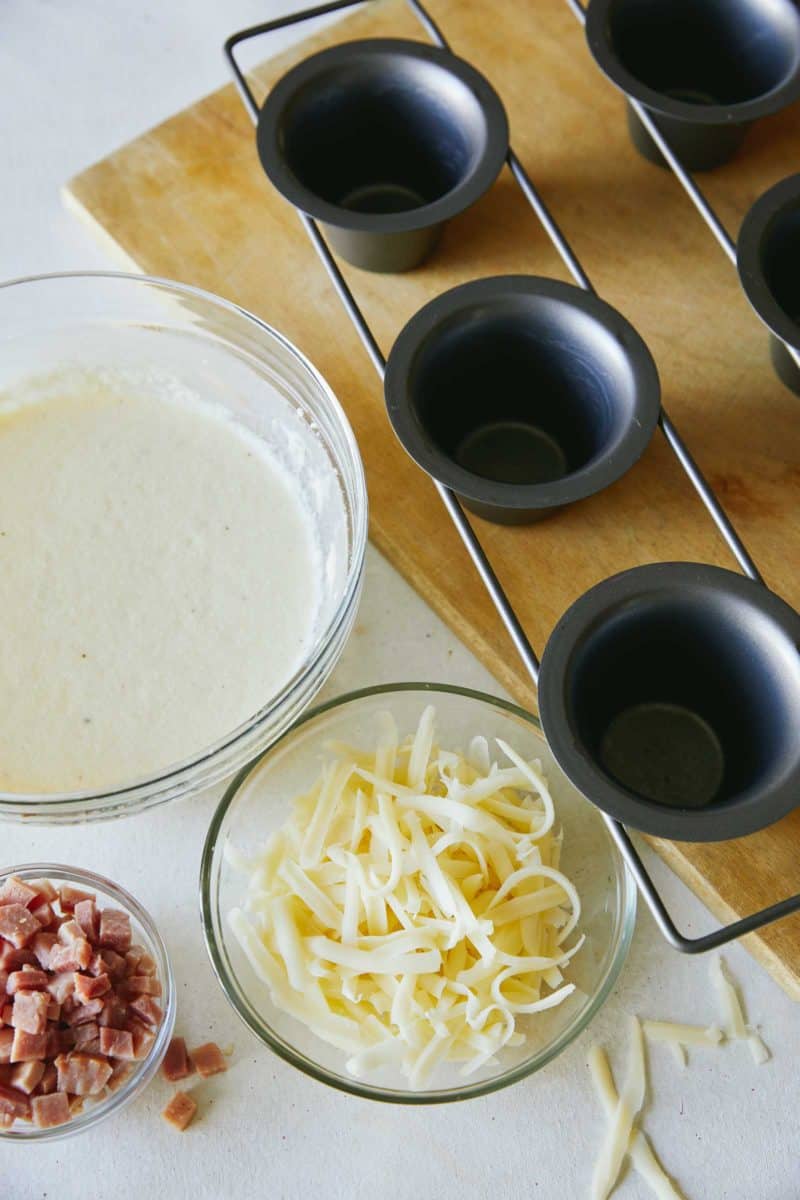 Ingredients and pan for ham and cheese popovers.