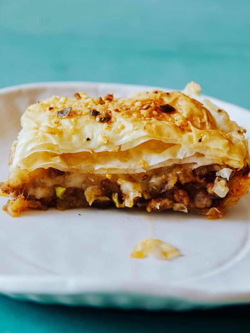 A close up of a piece of savory baklava.