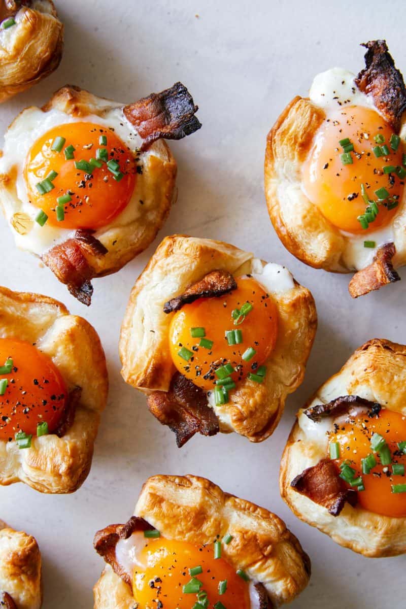 A close up of cheesy flaky breakfast cups.