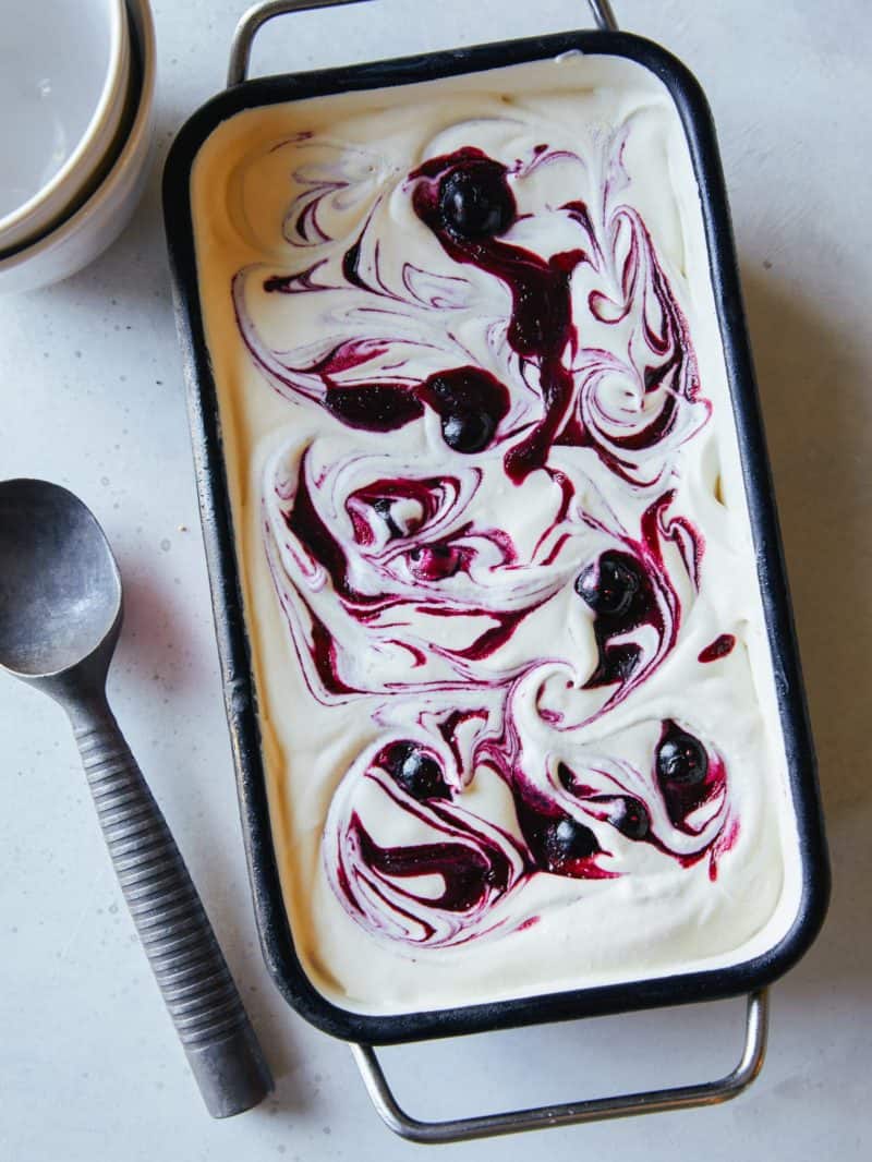 Blueberry vanilla honey swirl semifreddo with ice cream scoop.