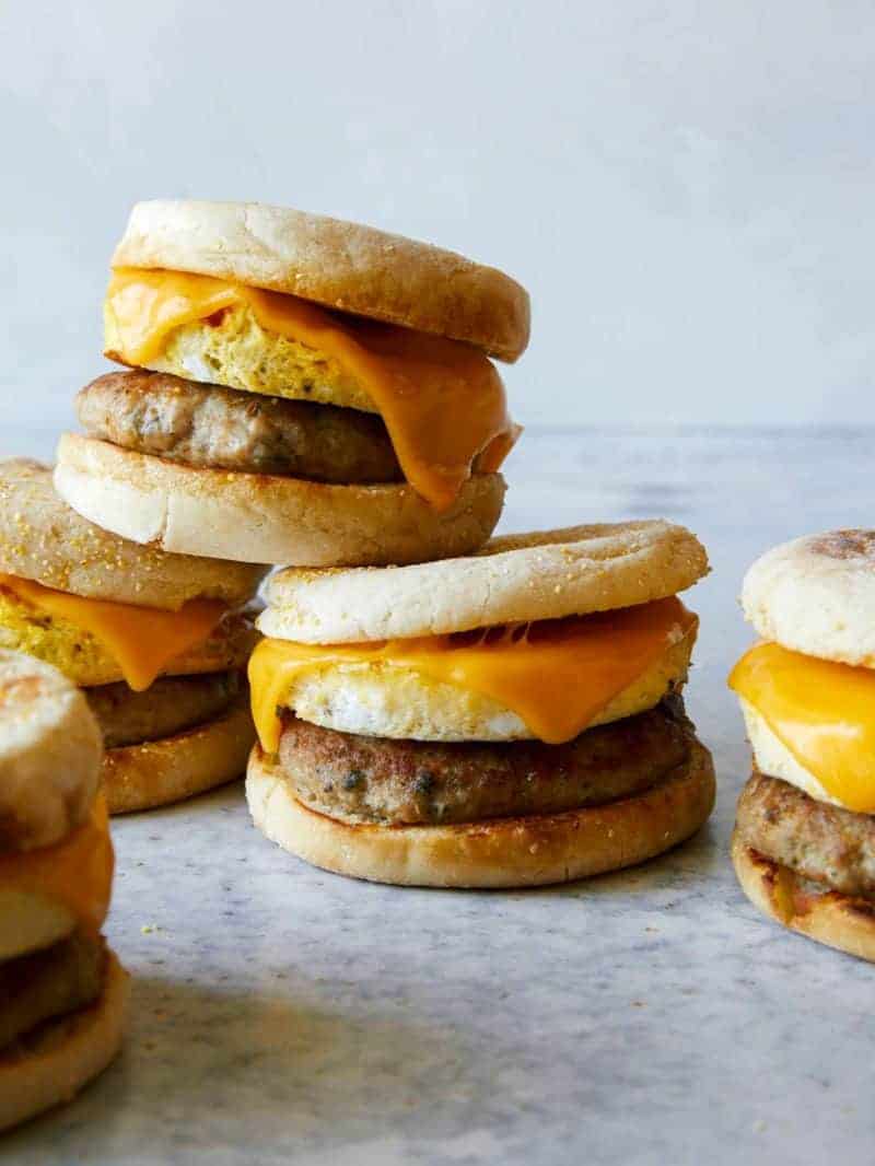 Stacked turkey sausage, egg and cheese breakfast sandwiches.
