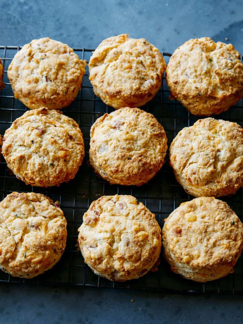 Ham and cheese buttermilk biscuits  in a grid on a blue background.