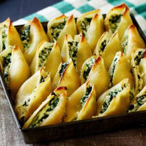 Close up on Ricotta and Spinach Stuffed shells after they are baked.