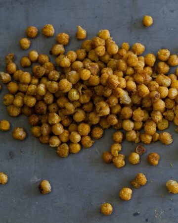 A close up of a pile of fried curry chickpeas.