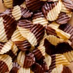 A close up of chocolate covered potato chips.