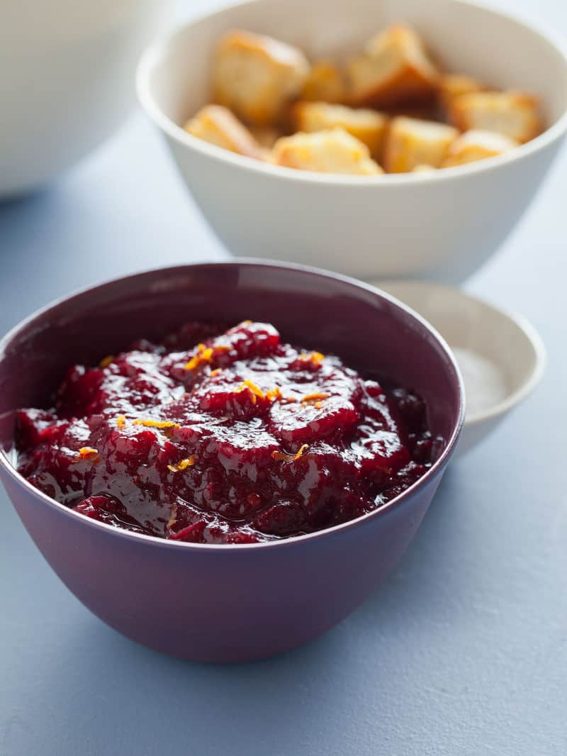 A close up of a bowl of cinnamon and star anise infused cranberry sauce.