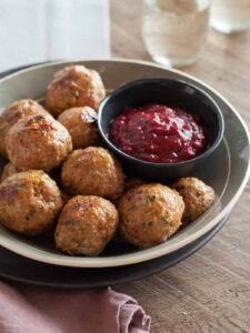 Perfect holiday recipe for Herbed Turkey Meatballs with a Barbeque Cranberry Sauce.