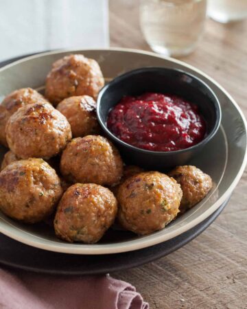 Perfect holiday recipe for Herbed Turkey Meatballs with a Barbeque Cranberry Sauce.