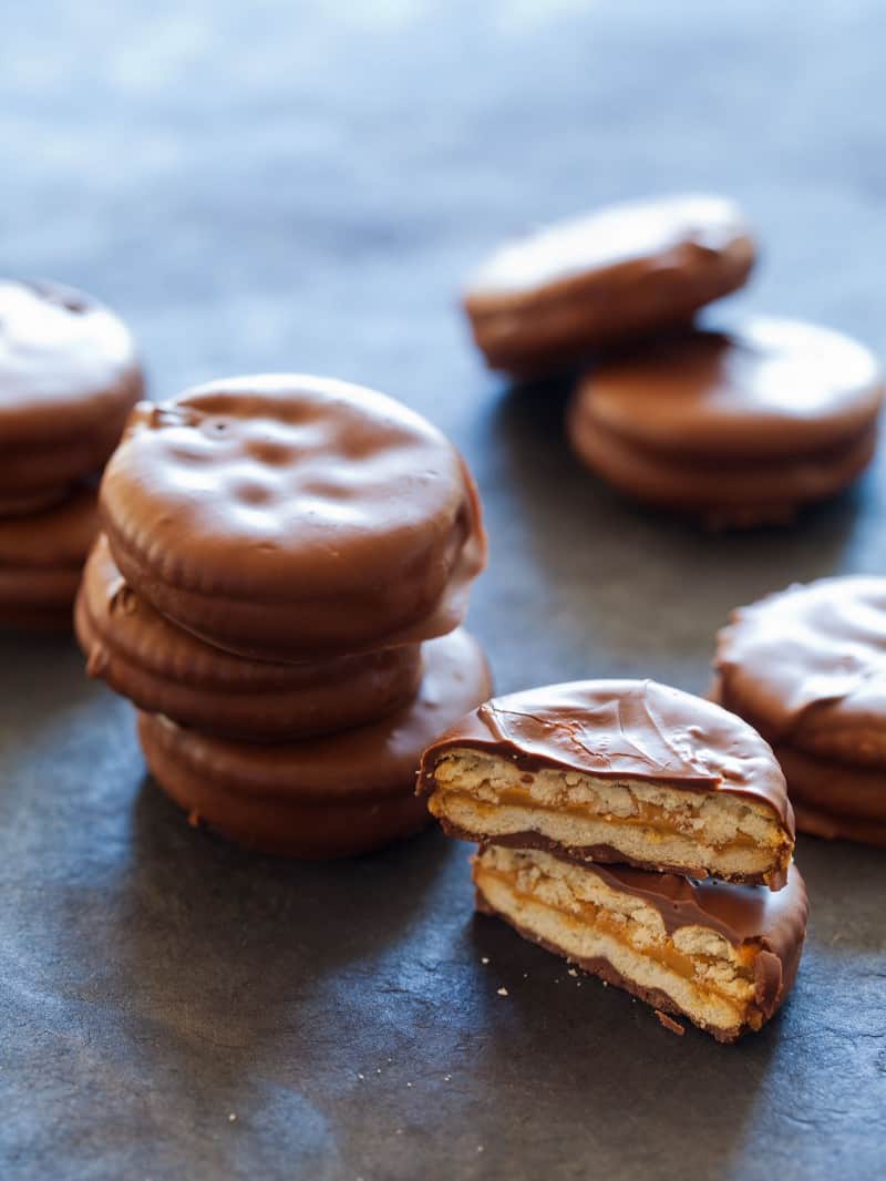 A close up of stacks of chocolate covered peanut butter Ritz sandwiches.