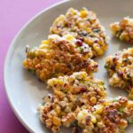 A close up of a plate of crispy corn cakes.