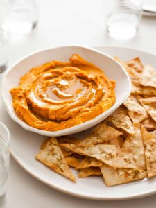 A recipe for Sweet Potato Hummus with Cumin Flatbread Chips.