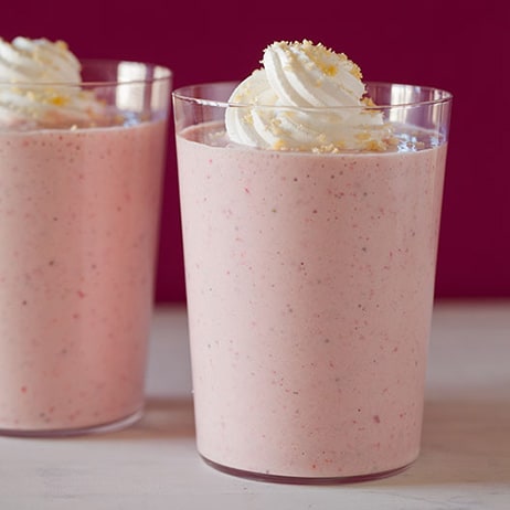 Two roasted strawberry shortcake shakes sitting next to each other. 