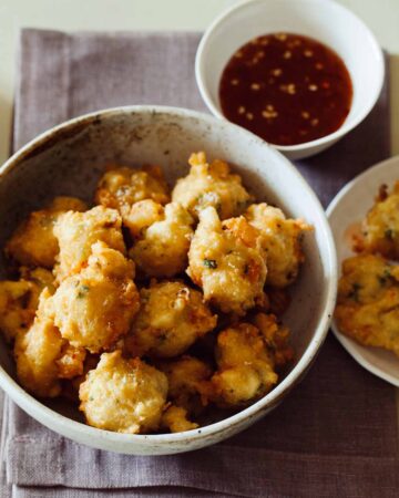 A recipe for Shrimp Fritters with a spicy honey drizzle.