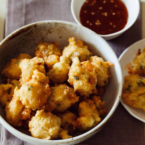 A recipe for Shrimp Fritters with a spicy honey drizzle.