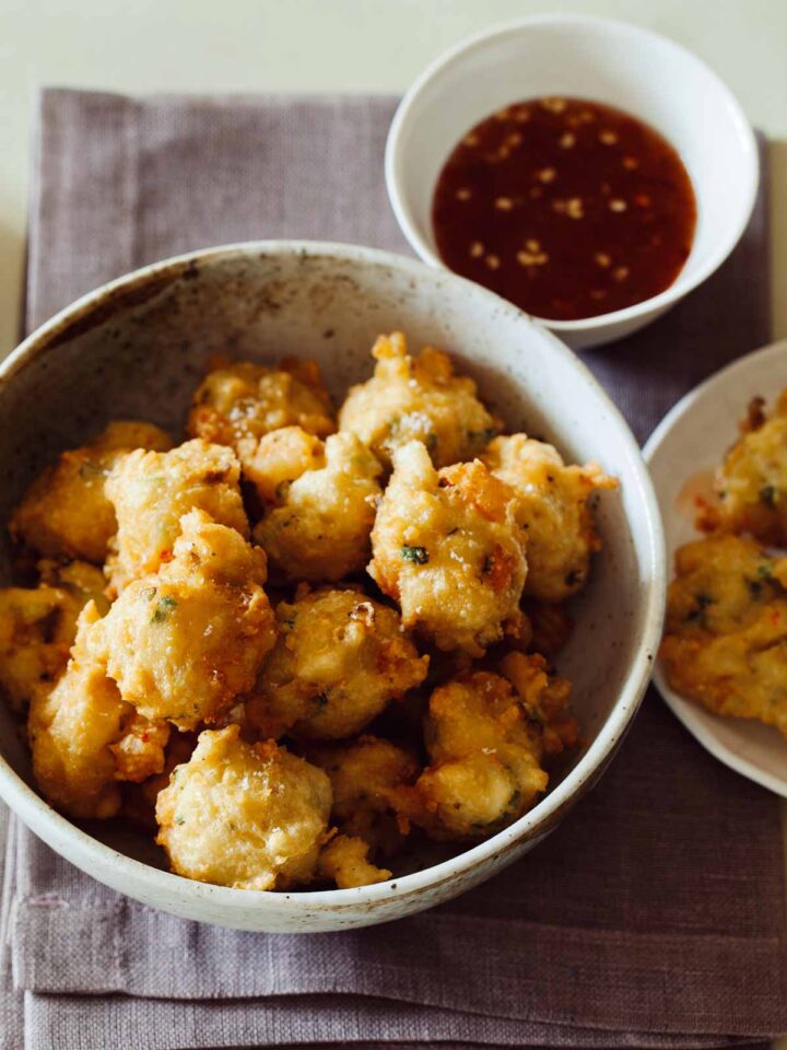 A recipe for Shrimp Fritters with a spicy honey drizzle.