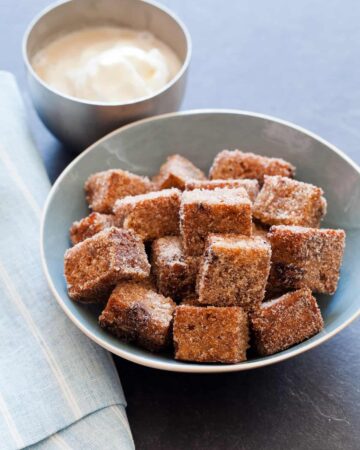 Banana Bread cut into cubes and fried, served with an ice cream dipping sauce.