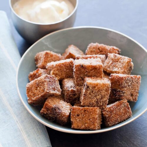 Banana Bread cut into cubes and fried, served with an ice cream dipping sauce.