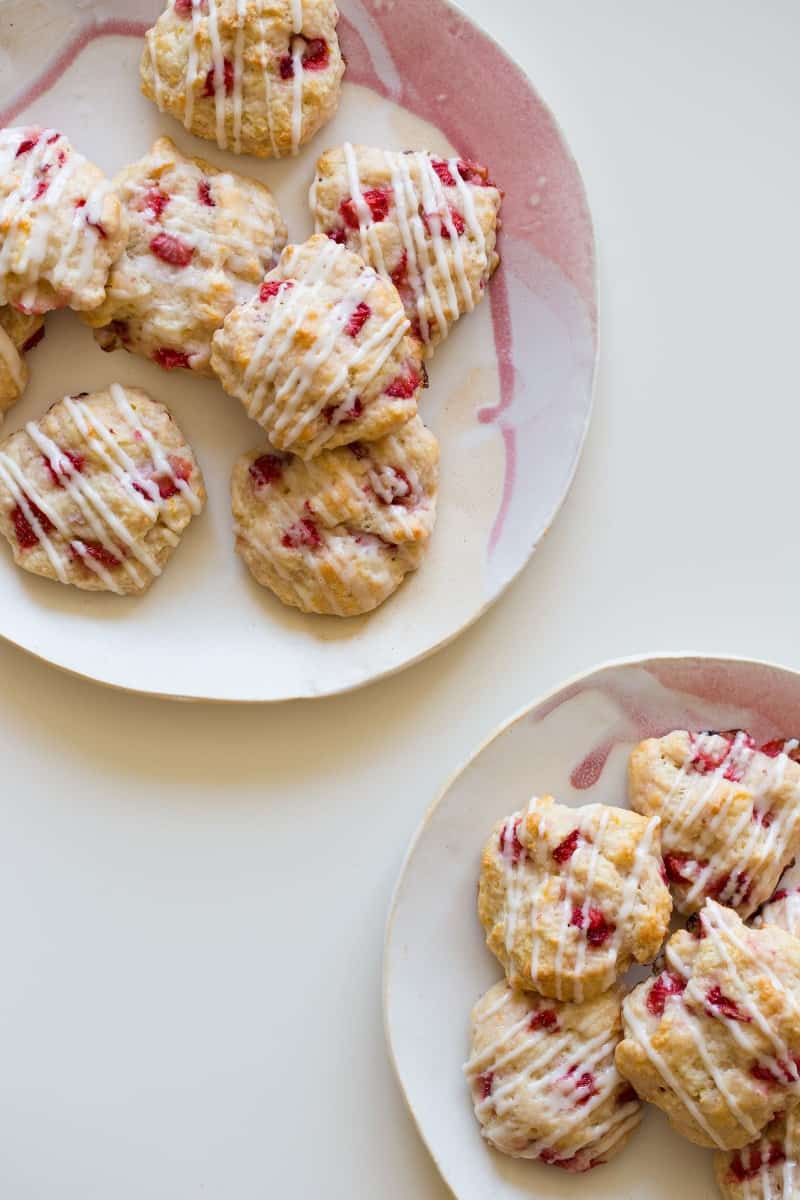 Strawberry Shortcake cookies on two plates. 