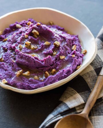 A recipe for Mashed Purple Sweet Potatoes with toasted pecans.