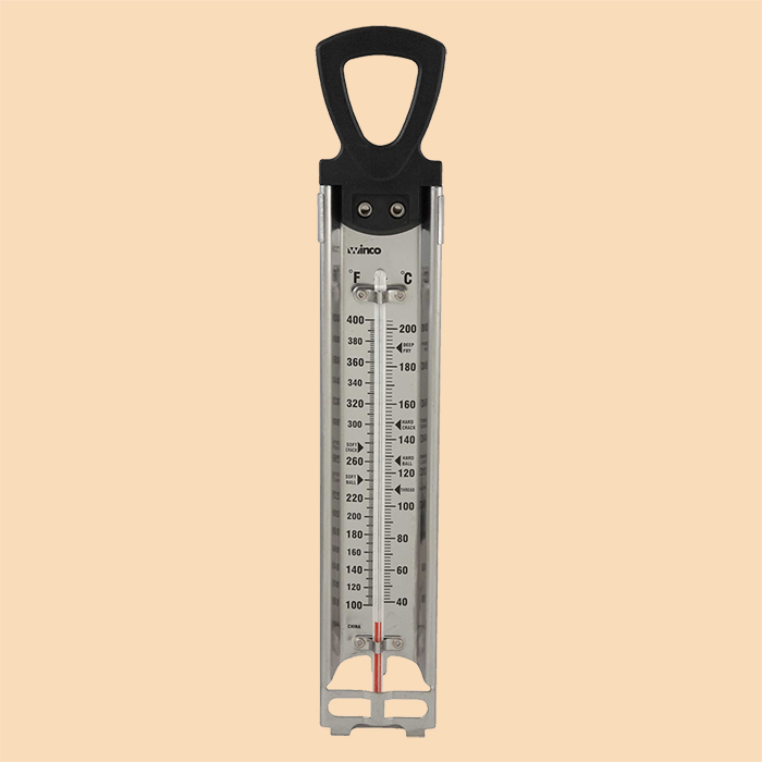 An image of a thermometer on a tan background. 