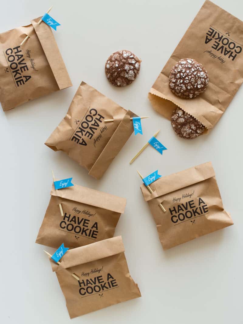 Cookie gift bags with "enjoy" labeled pick closures and homemade cookies.