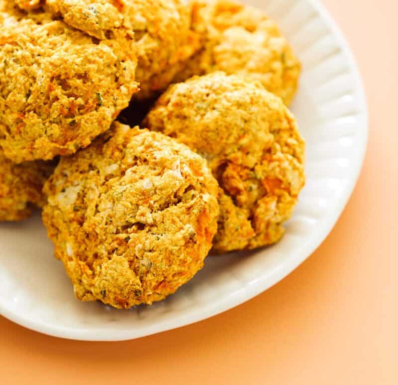A close up of a plate of sweet potato and rosemary biscuits.