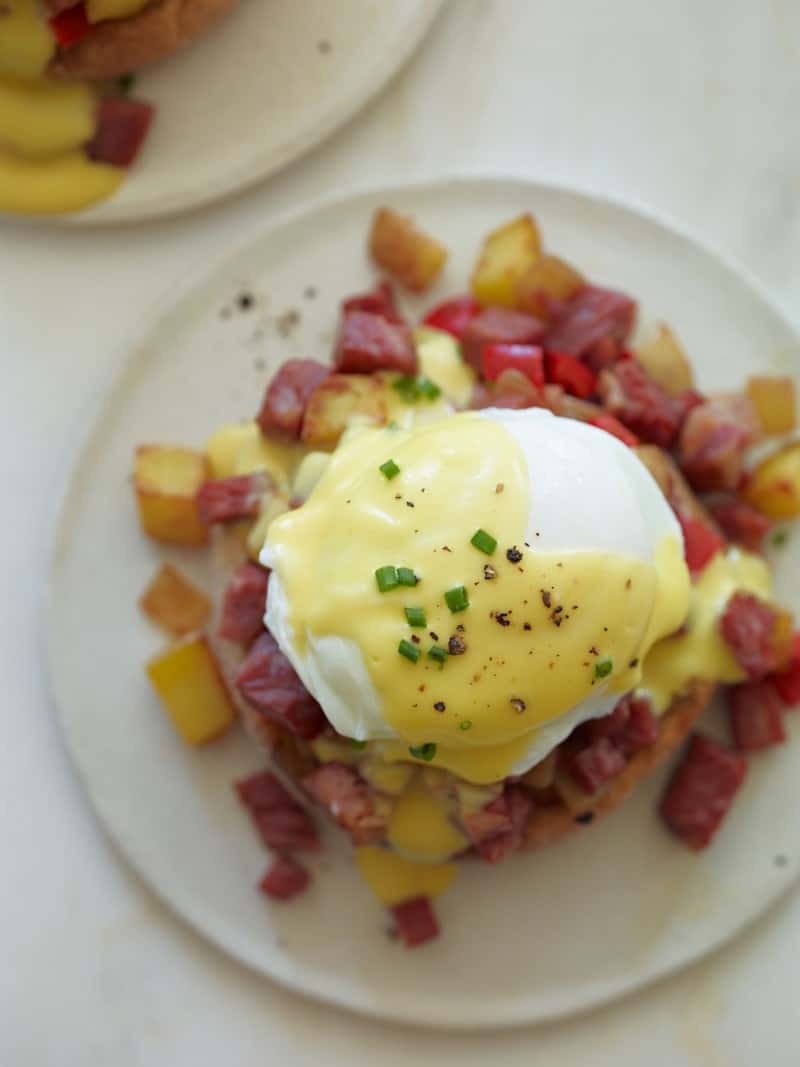 Corned Beef hash on an English muffin with an over easy egg and hollandaise sauce.