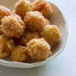 A close up of a bowl of peppadew poppers.