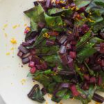 A close up of citrus sautéed beet stems.