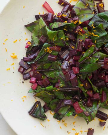 A close up of citrus sautéed beet stems.