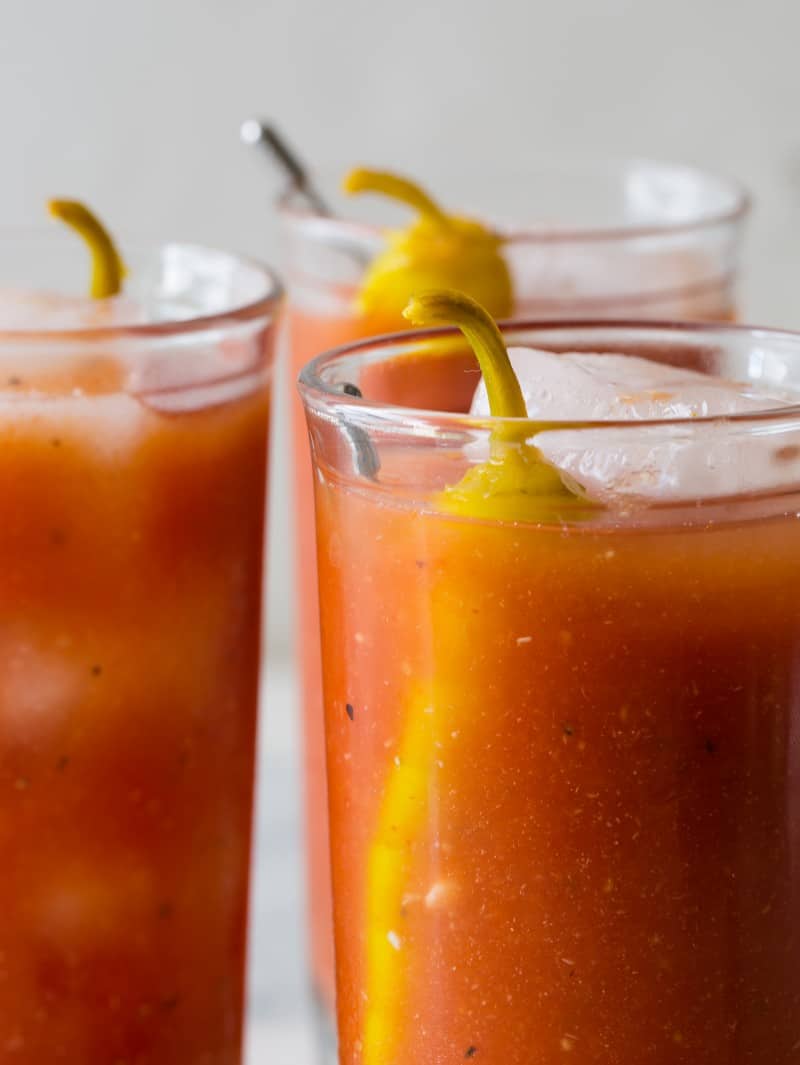 A close up on three bloody marys.