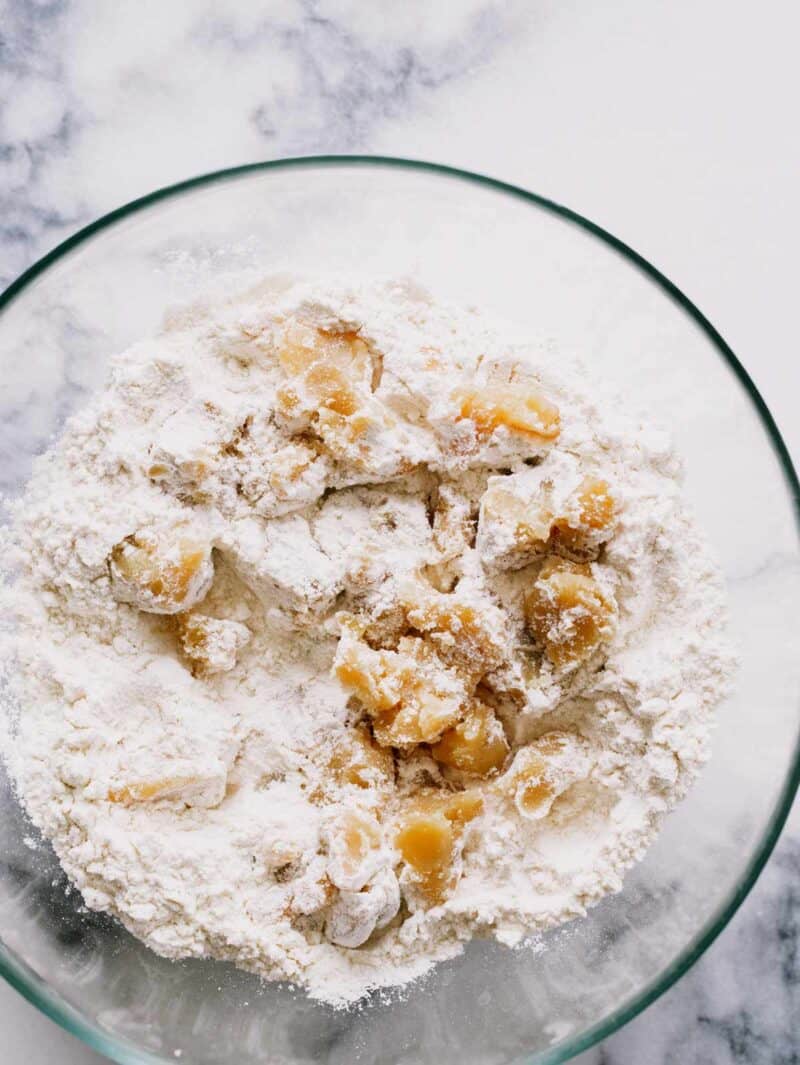 Browned butter being cut into the flour mixture for Brown Butter Biscuits