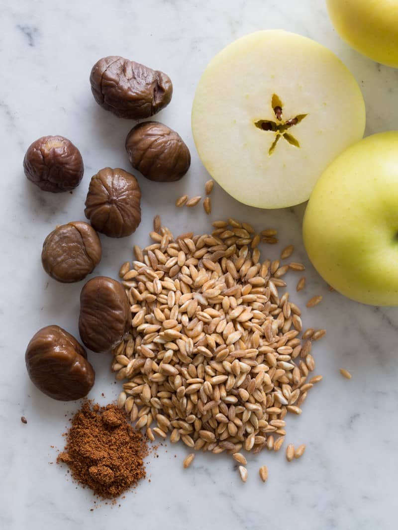 A close up of ingredients for cheesy apple faro cakes.