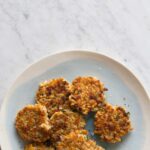 A plate of cheesy apple farro cakes.