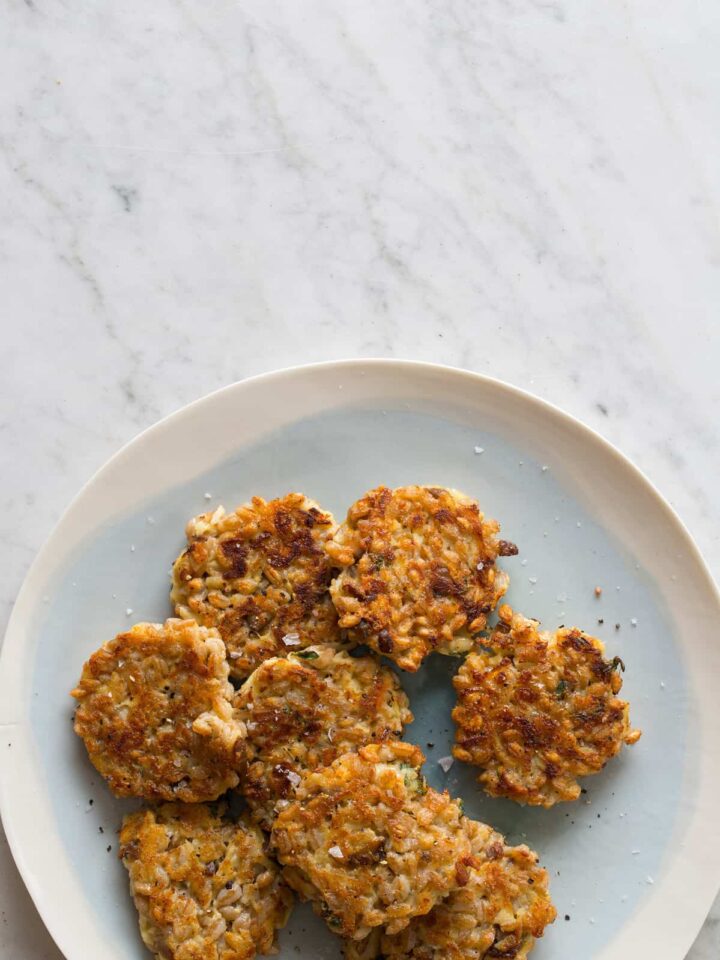 A plate of cheesy apple farro cakes.