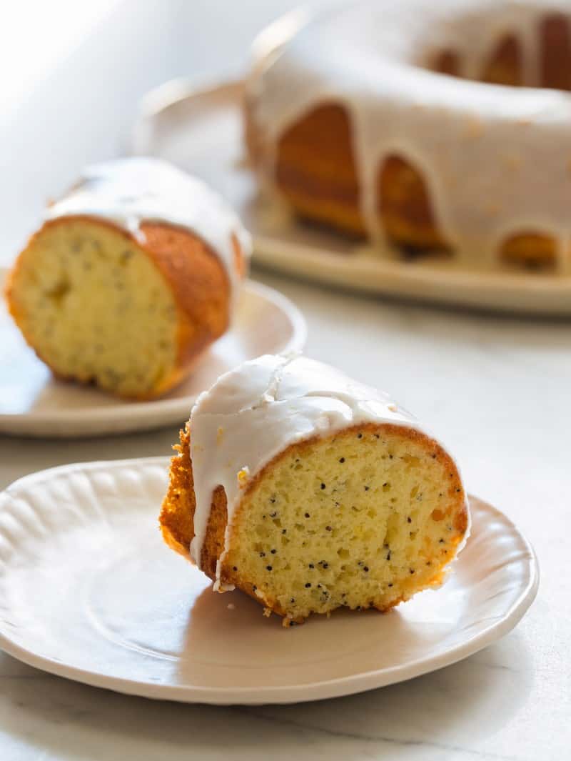 Two slices of Meyer Lemon Pound cake on plates.