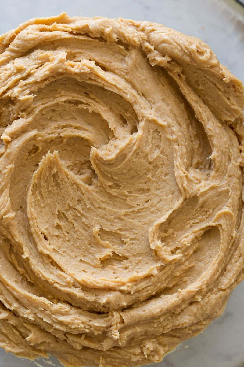 A close up of peanut butter buttercream frosting swirl.