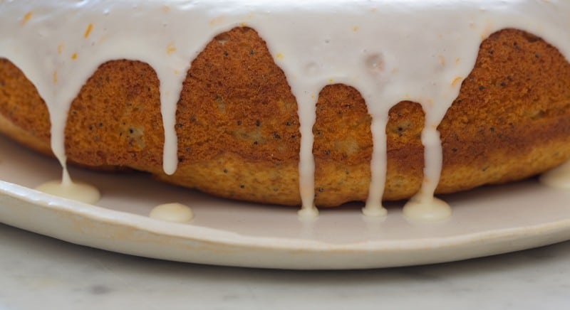 Pound cake with citrus and vanilla glaze up close on the drizzle. 
