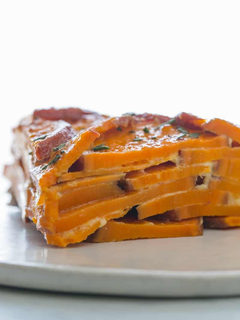 A close up on a slice of a sweet potato gratin.