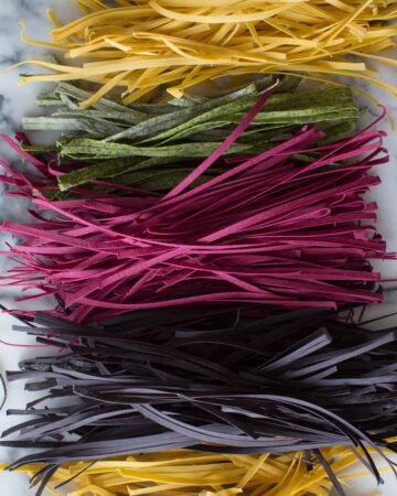 A colorful variety of homemade pastas lined up.