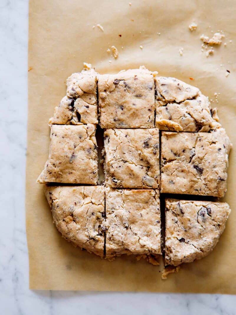 Chocolate chunk and cinnamon scones dough cut into squares before baking.