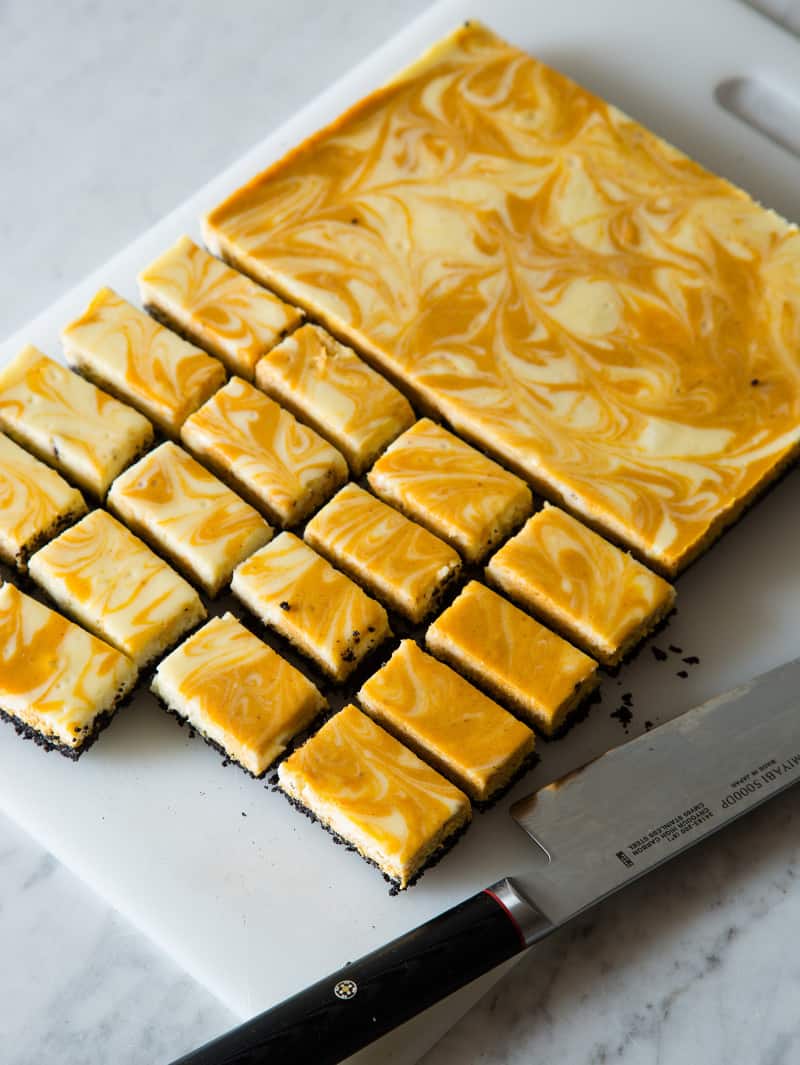 Marbled pumpkin cheesecake bars cup up into bars.