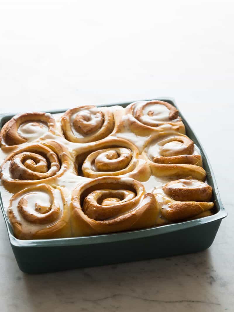 A square pan of glazed brown butter cinnamon rolls. 