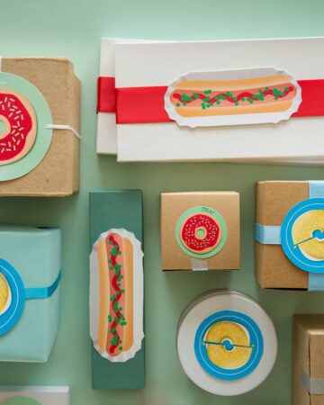 A variety of printable food gift tags on gift boxes.