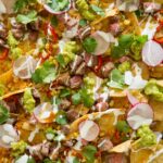 A close up of carne asada nachos.