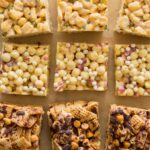 Three different kinds of marshmallow cereal treats on a piece of parchment.