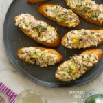 A plate of smoked trout on toast.