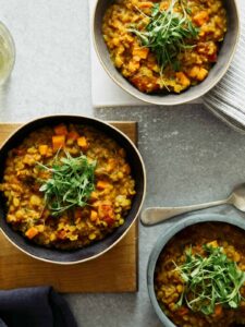 Several bowls of masoor dal. with spoons.