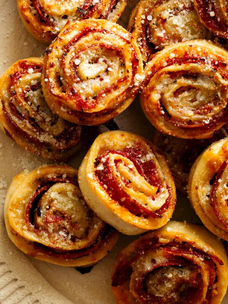A close up of pepperoni pizza wheels.